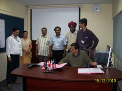 Shishir P. Deshpande, Head of the Indian Domestic Agency, after the signature with his team: Ujjwal K. Baruah, Chandramoulli Rotti, Narinder P. Singh, Dilshad A. Sulaiman, Aruna M. Thakar and KGV Nair. (Click to view larger version...)